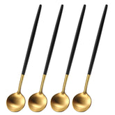 Dehov 4pc spoons with brush gold and black handles for elegant tabletop use.