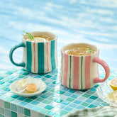 DELIGHTS GALORE striped mugs in pink and green, a two-pack for daily coffee rituals.