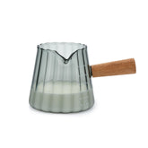 Denovin glass measuring cup 6oz with gray creamer pitcher for precise pours.