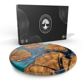 Designium olive wood round board with ocean waves resin for elegant cheese service.