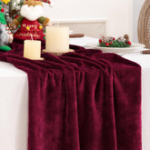DeZerlor burgundy velvet table runner draped on table for festive dining