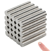 DIYMAG Small Stronge magnets on a fridge holding photos securely displayed