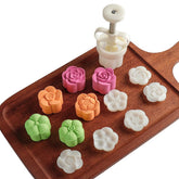 Dltsli mooncake mold set with six stamps for DIY desserts.