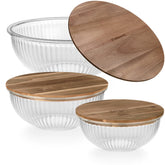 Dokaworld nesting bowls with acacia lids in 1.1 qt for compact storage.