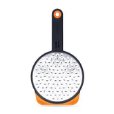 Dreamfarm Ograte bottom blades in circular motion for fast, even grating.