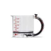 Dreamfarm Upcup adjustable-base measuring cup with multiple volumes for precise prep