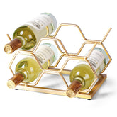 Drincarier countertop wine rack with five bottles in a gold finish, ideal for stylish kitchen storage.