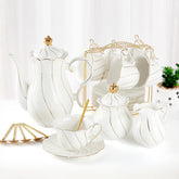 DUJUST white porcelain tea set on a stand, elegant presentation for guests.