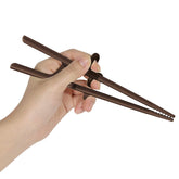 Edison Friends left-handed training chopsticks setup demonstrates guided grip for learning