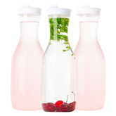 Elegant Disposables clear pitcher with flip-top lid, 50 oz, ideal for water and juice service