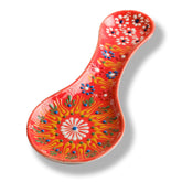 Evanilife orange ceramic spoon rest top view keeps countertops clean during cooking.