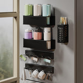Evemlceol magnetic cup holder on fridge securely grips a 40 oz tumbler.