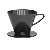 Fino pour-over cone placed over a mug for aromatic coffee