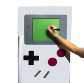 Fun Fridges FridgeBoy D-Pad magnet for gamer-style fridge control.