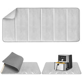 FYY heat-resistant mat protecting countertops from heat transfer during use.