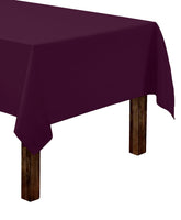 Gee Di Moda rectangle tablecloth in eggplant, flatlay, adds vibrant color to any dining setup.