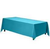 Gee Di Moda rectangle tablecloth 70x120 Caribbean on a dining table for six to eight guests.
