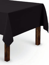 Gee Di Moda rectangle tablecloth on a 60 x 84 inch table for a clean, elegant black look.