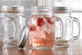 Glaver's Mason Jar 16oz mug with handle and lid, spill-proof for easy entertaining.