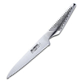 Global 6-inch serrated knife with razor-edge blade for precise tomato slicing.