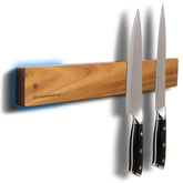 Gourmetop wall-mounted knife holder ready for use on a clean kitchen wall.