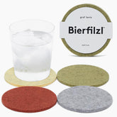 Graf Lantz Bierfilzl Merino coaster in mahogany protecting a surface and adding warmth.