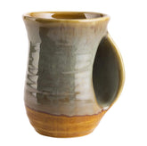 GUTE hand warmer mug in desert green finish warms the hand with stylish ceramic design.
