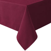 H.VERSAILTEX linen-textured tablecloth on a dining setup, offering durable protection and elegant fabric.