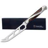 Hammer Stahl Cheese Knife 5-Inch Blade slicing cheese smoothly on a board.