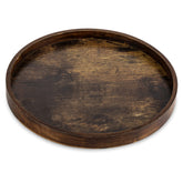 Hanobe round brown decorative tray on coffee table organizes remotes and snacks.