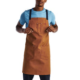 Hedley & Bennett crossback apron with pockets for quick tool access in busy kitchens.
