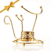 Hemswell Crystal Brandy Warmer Stand in gold enhances cozy evenings with warm ambiance.