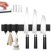 Hereof knife strip with 3 hooks securely mounted on wall for space-saving.