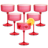 HKSZEH red ribbed coupe glass with gold rim for cocktails.