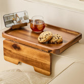 HOLANA acacia couch armrest table securely clips onto a wide sofa for easy snacking
