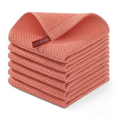 Homaxy 100% cotton waffle dishcloth in coral, ultra-absorbent for quick drying.