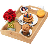 HOME IT tray with large handles on a coffee table for easy serving.