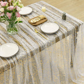 Horaldaily beige gold gauze tablecloth on a rectangular table for elegant gatherings.