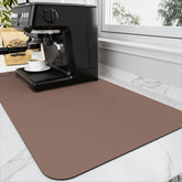 HotLive coffee mat with absorbent surface catching spills and quick drying under espresso machine.