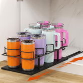 Housolution pull-out water bottle organizer in cabinet for easy access.