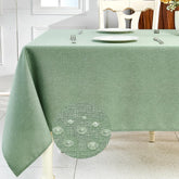 IVAPUPU textured linen tablecloth in sage green protects tabletops during meals.