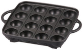 Iwatani Takoyaki Grill Pan medium black, top view with 16 holes for even cooking.