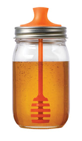 Jarware honey dipper lid in orange on a 16 oz regular-mouth jar for mess-free honey.