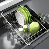 JASIWAY dish drying rack in sink with integrated utensil holder for a tidy kitchen.