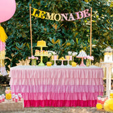 Jevix pink tutu table skirt on a rectangular table adds festive flair