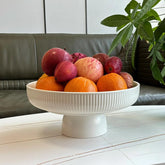JolieJulie ceramic fruit bowl on pedestal with white glaze, ideal counter décor.
