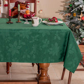 Joyfol Day green Christmas tablecloth with poinsettia pattern for festive dining ambiance.