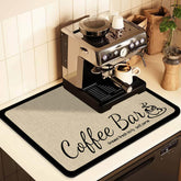 JuSiyley coffee mat under the coffee maker protects countertops from spills.