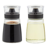 Juvale glass oil and vinegar dispensers with no-drip design for mess-free pouring.