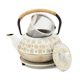Juvale stovetop cast iron tea kettle with white finish on stove for elegant brewing
